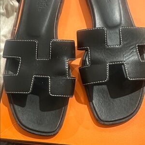 Hermès Oran black sandals size 38.